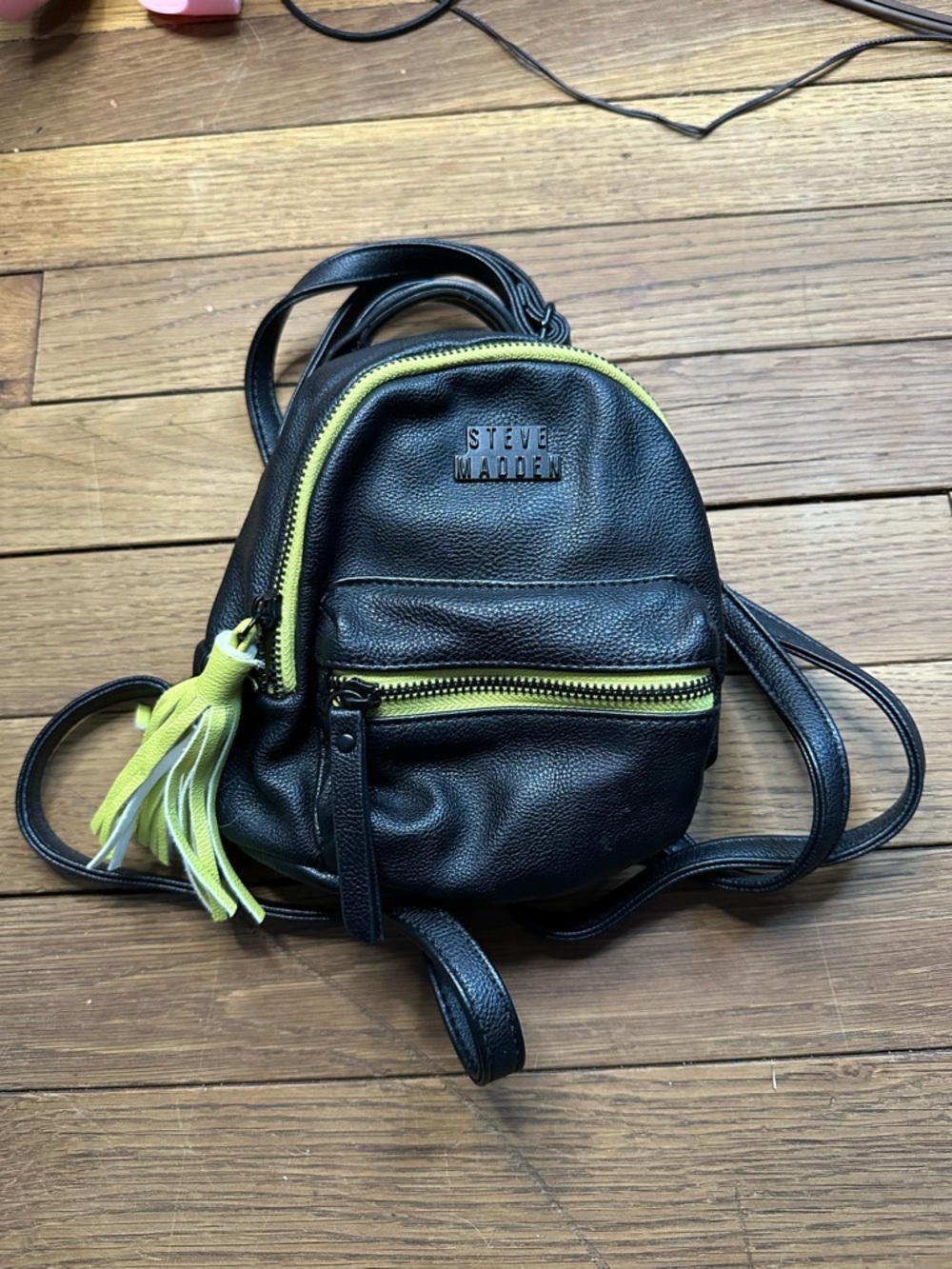 Steve Madden Black Mini Backpack with Yellow Accents and Tassel